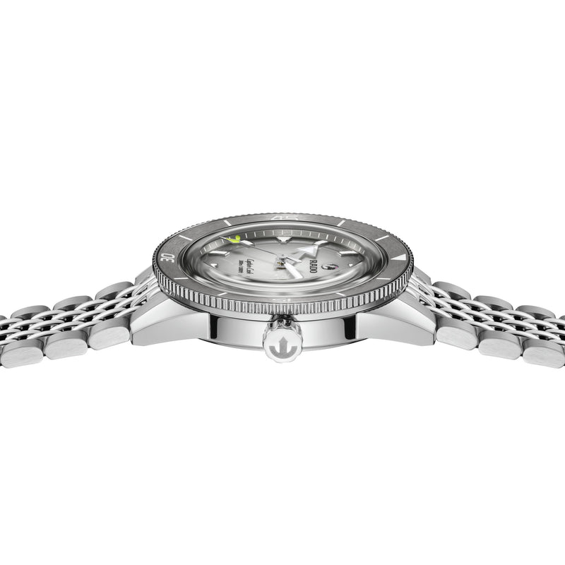 Rado Captain Cook X Tennis 39mm automatic dive watch, side view. Grey dial, ribbed bezel, steel crown, multi-link bracelet.