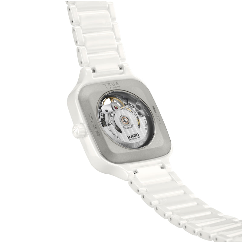 Rado True Square automatic watch, white ceramic case and bracelet, detailed Swiss movement visible through exhibition back.