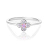 A pink diamond flower ring featuring a central round pink gemstone surrounded by four clear round-cut stones, set on a polished silver band, shown on a white reflective background.