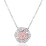 A pendant necklace featuring a circular floral design with a central cluster of pink gemstones surrounded by small clear stones, suspended from a delicate silver chain on a white background.