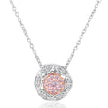 A pendant necklace featuring a circular floral design with a central cluster of pink gemstones surrounded by small clear stones, suspended from a delicate silver chain on a white background.
