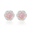 A pair of round stud earrings featuring a central cluster of light purple stones surrounded by a rose gold bezel, set in a silver-toned filigree border with small clear accent stones, shown on a white background with a soft reflection.