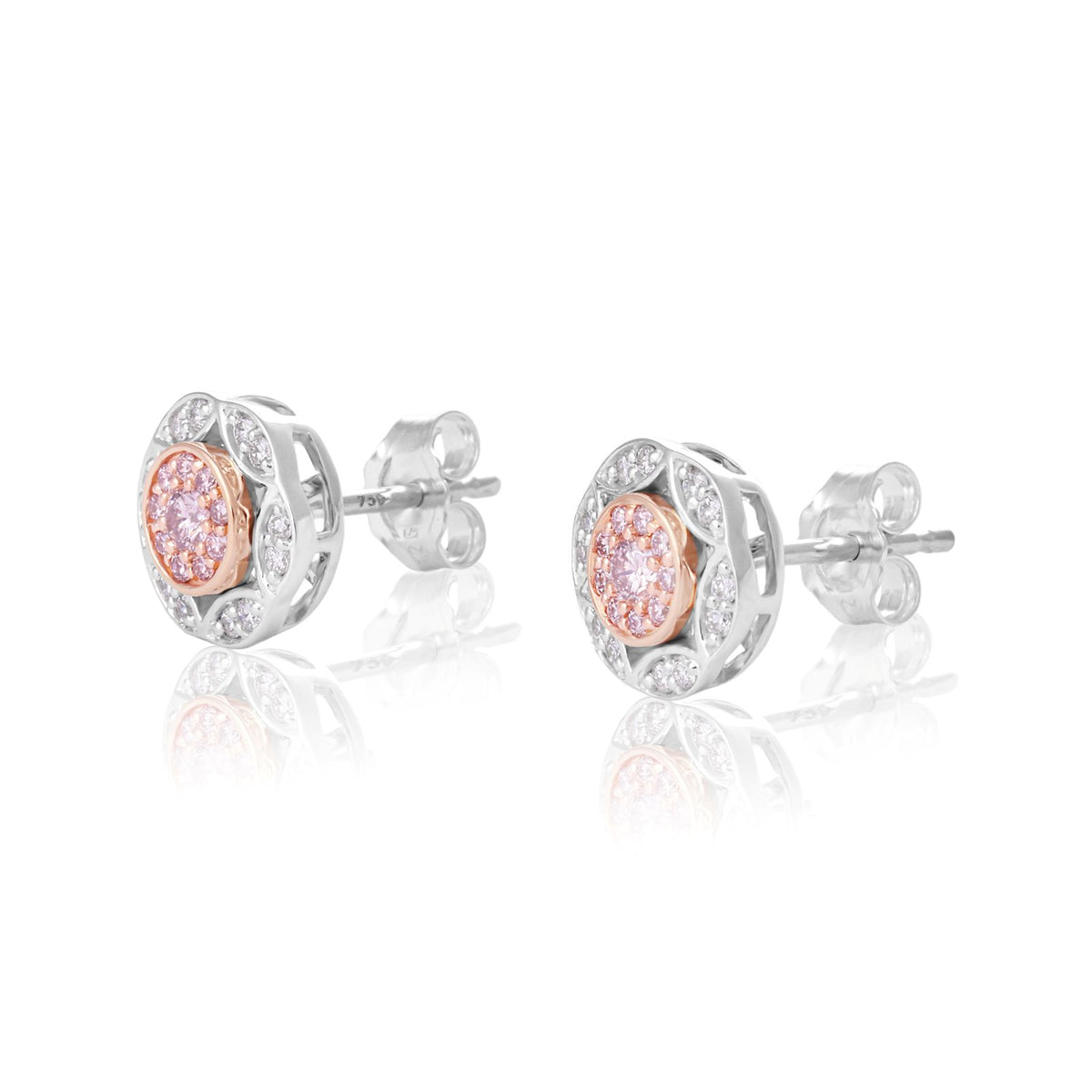 A pair of round stud earrings in silver-tone metal with a central cluster of pink gemstones surrounded by smaller clear stones, shown on a white background with soft reflections.