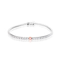 A tennis bracelet featuring a single rose gold oval center stone, displayed on a clean white background with a soft reflection.