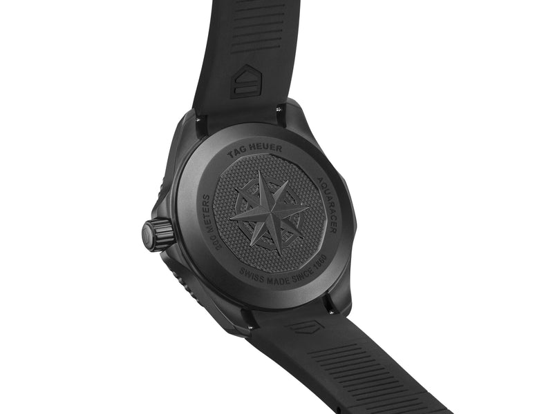 Black TAG Heuer Aquaracer Solargraph watch, back view, with rubber strap and embossed compass rose.